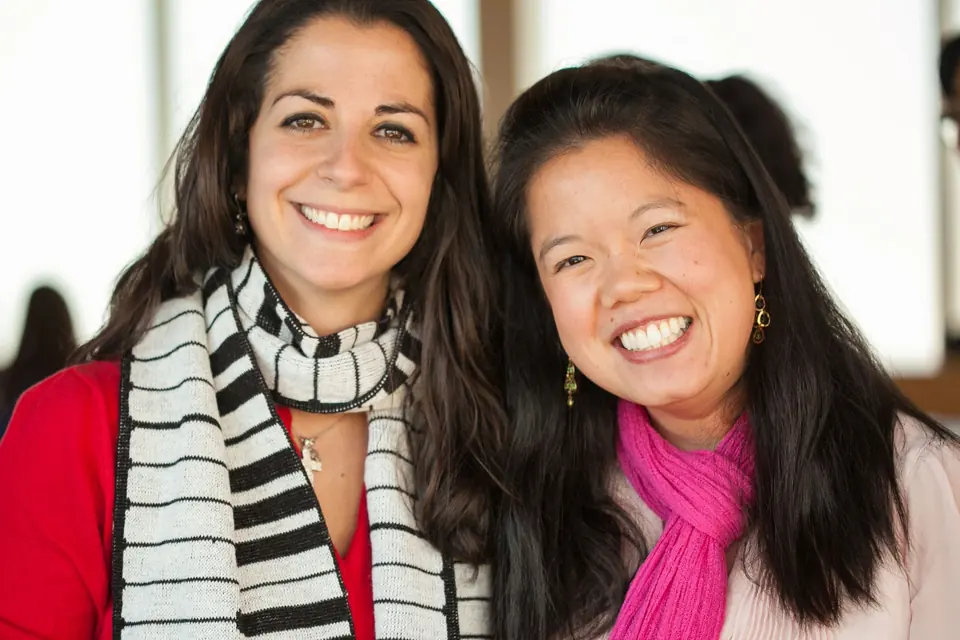 Two BPS school psychologists smiling together at a department event